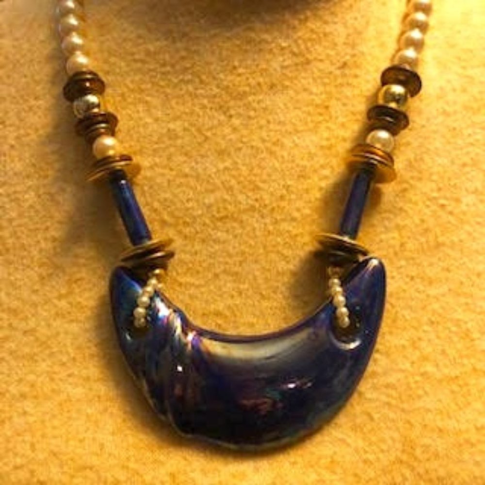 Quarter Moon Glass Stone Necklace hangs on Blue Beads and Pearls Necklace